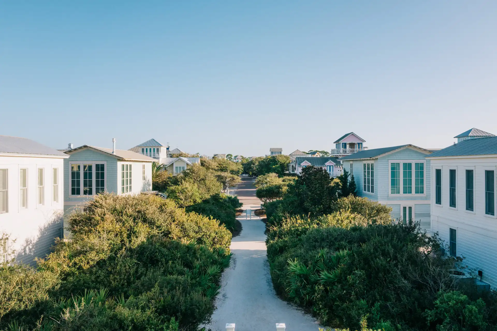 Seaside Homes | Path through the community with geen vegetation