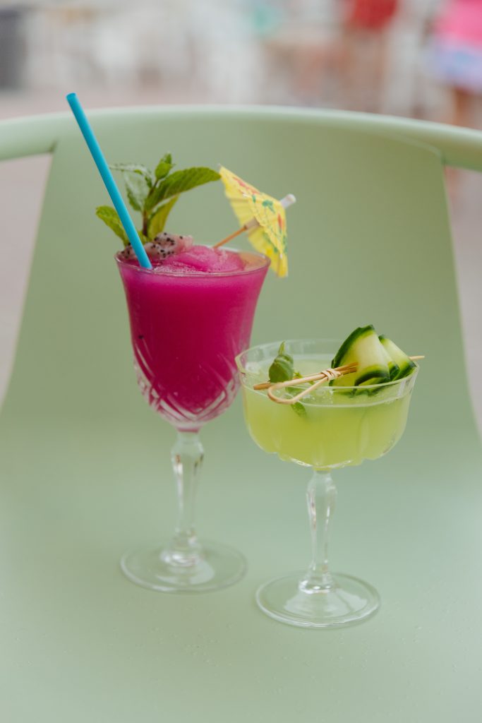 Tropical cocktails at Daytrader Tiki Bar & Restaurant in Seaside, Florida, featuring colorful tiki-style drinks with fresh garnishes at the Coleman Beach Pavilion on 30A.
