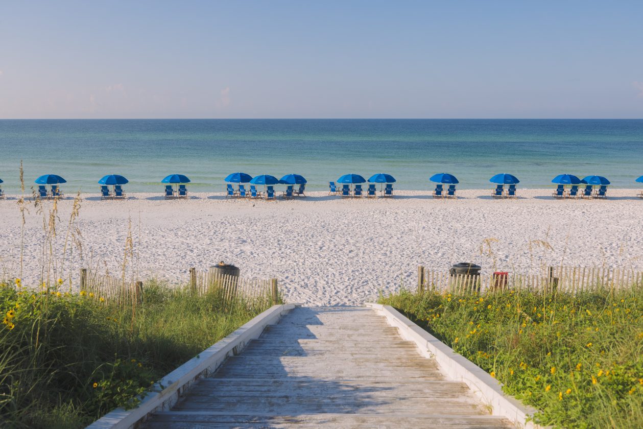 Turquoise Gulf water and white sand beach at Seaside, Florida on a clear summer day