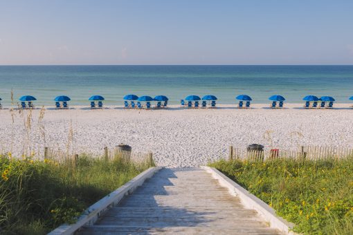 Turquoise Gulf water and white sand beach at Seaside, Florida on a clear summer day