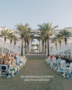 photo of a wedding at the seaside lyceum lawn showing the lyceum gateway, palm trees, chairs, and florals